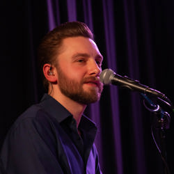 Sam of the Beeston Street Band on piano 