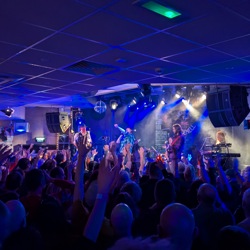 What an incredible crowd, hands in the air, rocking out to the iconic spirit of the night!